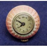 An early 20th century 935 silver and pink enamel guilloch case ball shape pendant watch, silvered