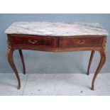 A Louis XV style console table of serpentine form with white veined marble top above a pair of