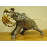 A mid/late 20th century Italian pottery model of an Elephant with a Tiger, natural colourways,