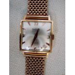 A gent's Swiss vintage 18ct gold wrist watch by Curtis, square face with silvered dial, 3,6,9 and 12