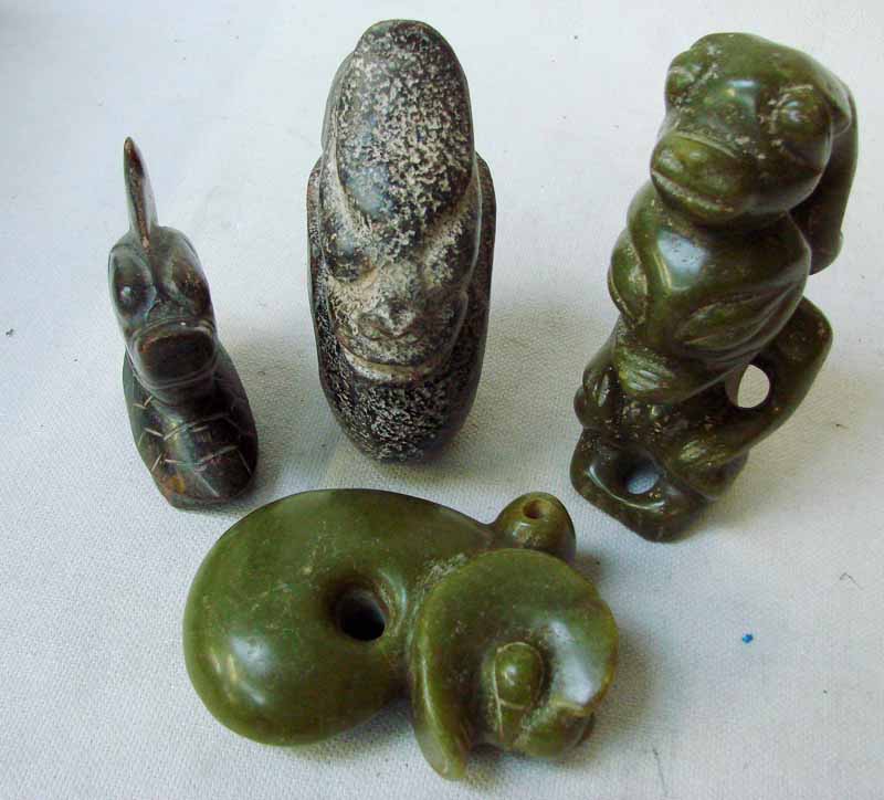A collection of four Chinese Hongshan jade/hardstone figures/devices, 10cm to 15cm (4)