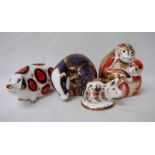 Four Royal Crown Derby bone china paperweights modelled as a monkey and baby, 10cm high, a badger,