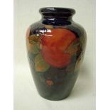 A William Moorcroft pottery vase of ovoid form, tubeline decorated in the Pomegranate pattern on