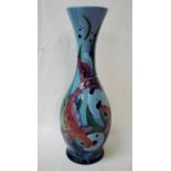 A modern Moorcroft pottery vase of ovoid waisted form, tubeline decorated in the Blue Ebro design by