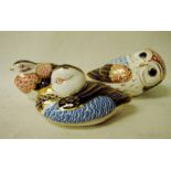 Three Royal Crown Derby bone china paperweights modelled as a duck, 11cm long, an owl, 13cm long and