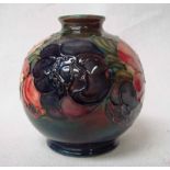 A Walter Moorcroft vase of globular form with short narrow neck, tubeline decorated in the Anemone