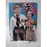 A Nazi Germany KPM plaque of rectangular form transfer decorated in colour with a boy and girl in