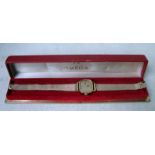 An Omega De Ville yellow metal ladies wrist watch, rounded rectangular face, gilt dial with baton
