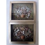 A pair of Victorian shell dioramas a still life basket of flowers, on an olive green fabric ground