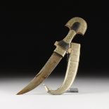 A WEST AFRICAN ENGRAVED SILVER METAL AND CARVED WOOD DAGGER, TUAREG, 20TH CENTURY, the guilloche and