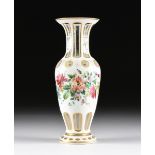 A BOHEMIAN PARCEL GILT AND POLYCHROME ENAMELED WHITE CUT TO CLEAR VASE, EARLY 20TH CENTURY, of