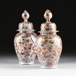 A MATCHED PAIR OF CHINESE IMARI PORCELAIN LIDDED JARS, each of ovoid form and painted in traditional