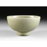 A CHINESE CELADON BOWL, 20TH CENTURY, of tapering circular form and an interior fretwork banded rim,