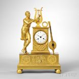 Gilt-brass Figural Mantel Clock, France, c. 1840, the standing figure and five-string instrument