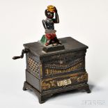 Painted Cast Iron Organ Mechanical Bank, the articulated monkey holds a paddle for the coin in one