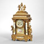 Gilt-metal and Porcelain Mantel Clock, France, c. 1900, two putti flank the white-painted