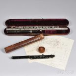 American Silver Flute and a 19th Century French Wood Piccolo, the flute body joint with gold