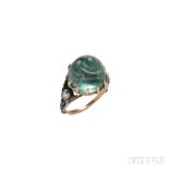 Emerald and Diamond Ring, prong-set with a high-domed circular cabochon emerald measuring approx.