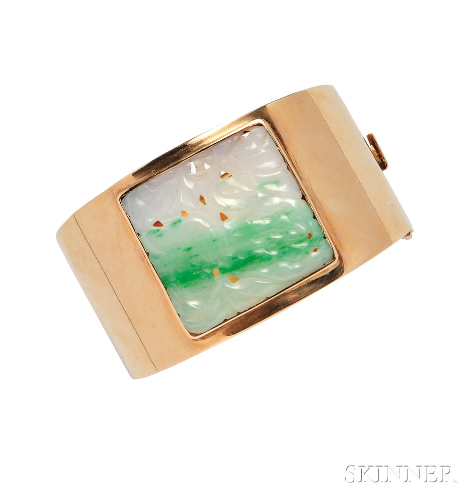 14kt Gold and Jade Bracelet, the wide, hinged bangle centering a carved jade plaque, 39.7 dwt,