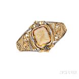 18kt Gold, Citrine Cameo, and Diamond Bracelet, c. 1920s, the hinged bangle bezel-set with a citrine