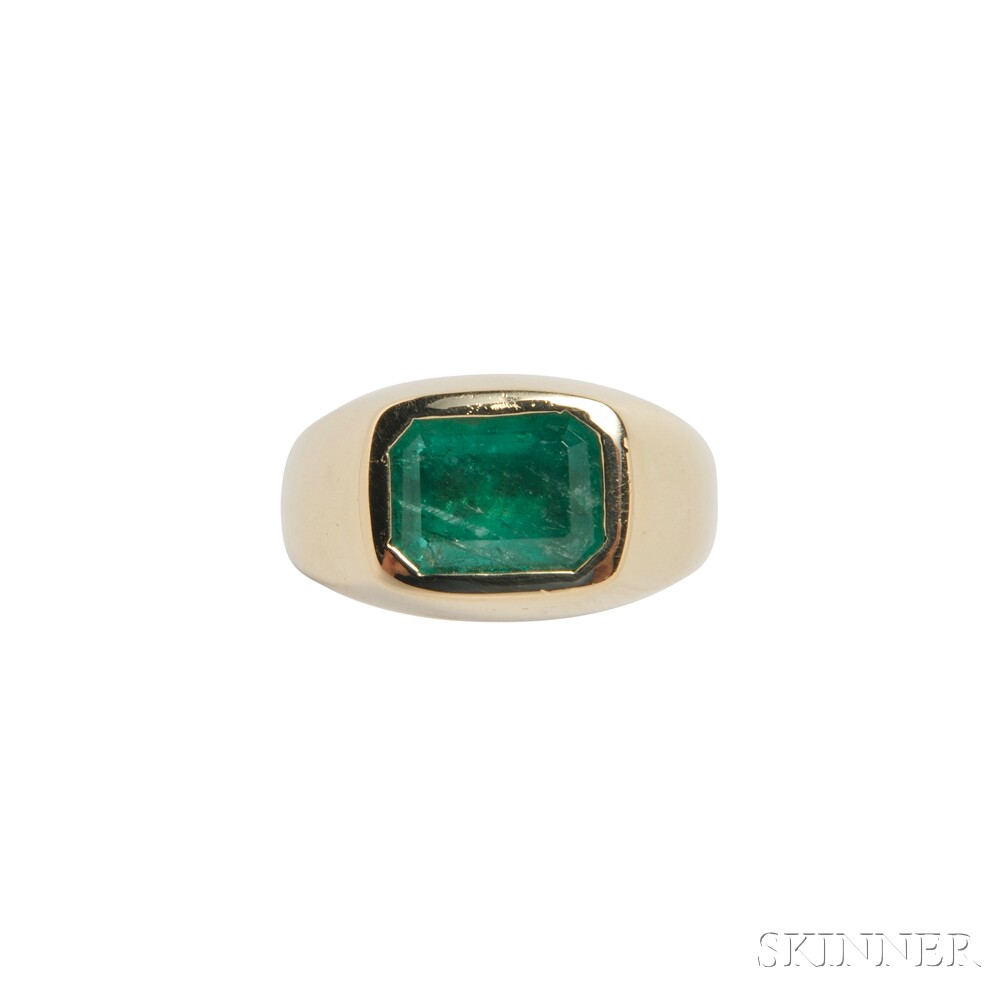 18kt Gold and Emerald Ring, bezel-set with an emerald-cut emerald measuring approx. 10.50 x 7.60 mm,