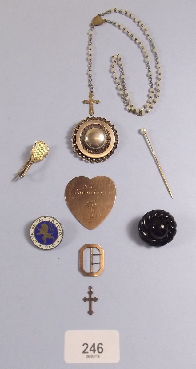 A box of jewellery including silver brooch, gold plaque, stick pin, gold buckle etc