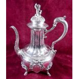 A French silver coffee pot with cherub finial and engraved and applied decoration - Paris 1870 by