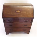 An Edwardian mahogany inlaid bureau with slope front over three drawers