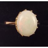 An 18 carat gold Burmese milk opal ring