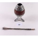 An Argentinian 800 standard silver mounted nut form tea beaker and matching straw