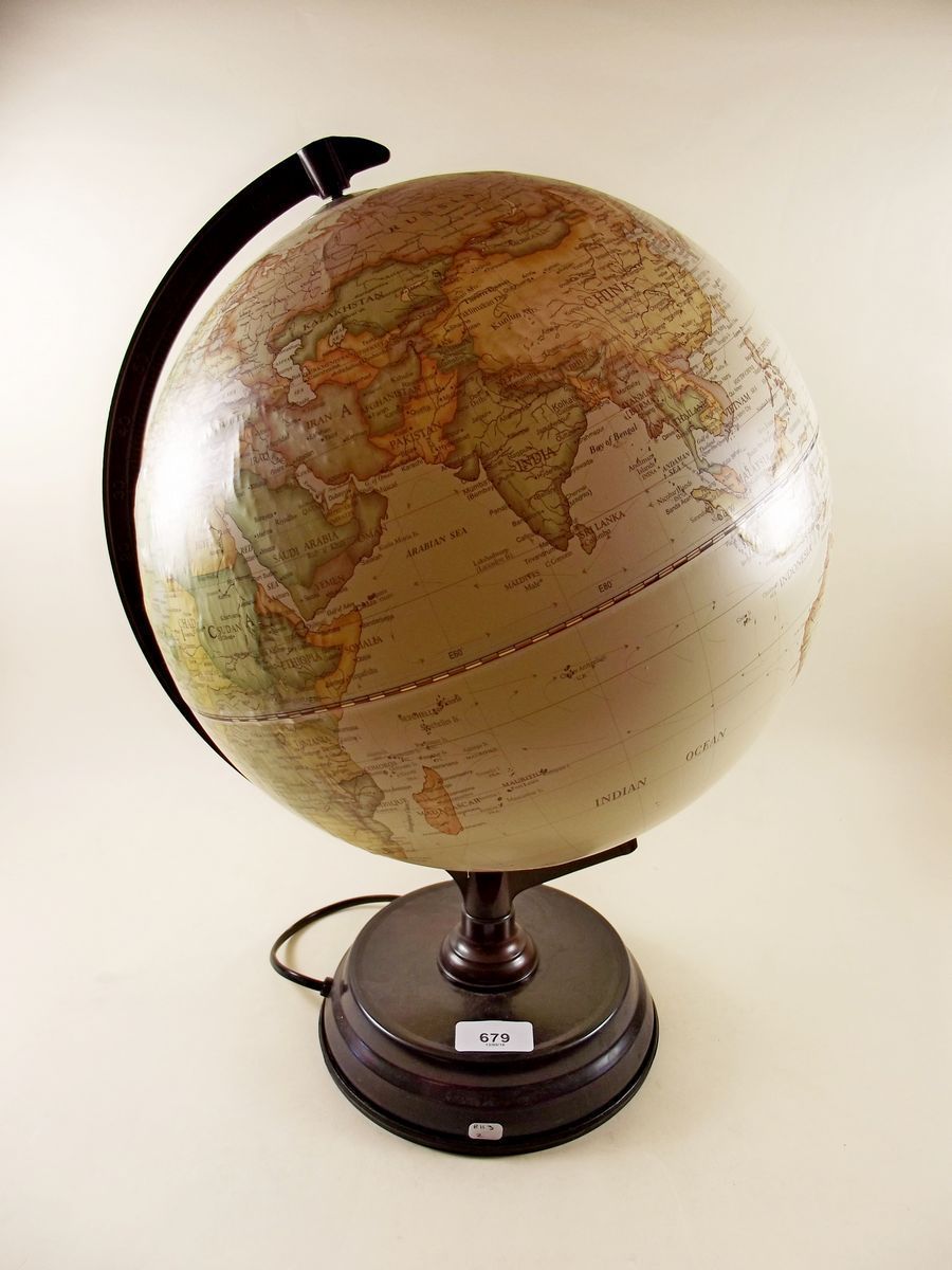 An illuminated globe on stand