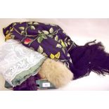 A black silk shawl with all over floral decoration, two fur scarves etc.