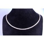 An 18 carat white gold single row diamond set necklace (approx. 3 carats)