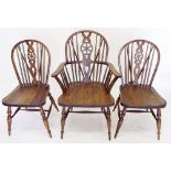 A set of eight wheel back dining chairs (6 diners & 2carvers)
