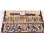 A set of six silver plated apostle teaspoons and cake forks, boxed