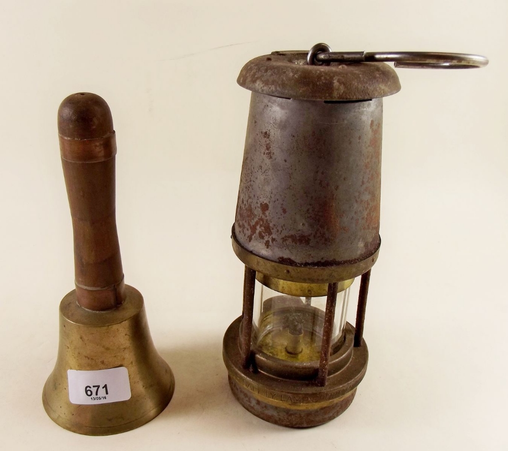 A Wolf safety mining lamp and a hand bell