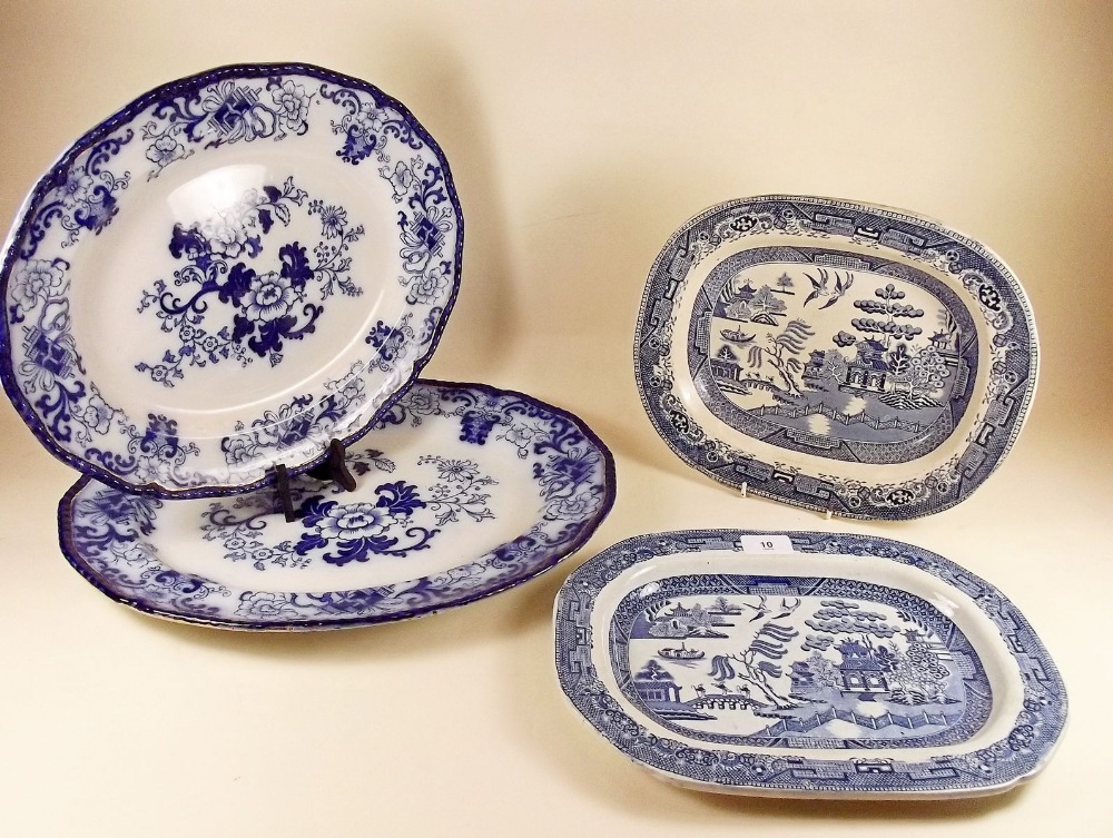 Two Doulton blue and white meat plates and two Victorian willow pattern plates
