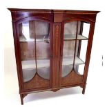 An Edwardian two door mahogany display cabinet with satinwood banding and husk marquetry