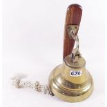 A brass bell on bracket