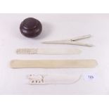 Three Victorian/early 20th century ivory paper knives, pair of bone glove stretchers and a brass