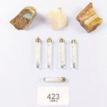 Three opal stones and five opal fragment tubes