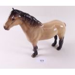 A Beswick palomino horse, ears repaired