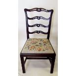 An early 20th century Hepplewhite style chair with carved horizontal splat back