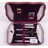 An early 20th century ivory manicure set, boxed