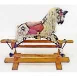 An early 20th century small painted rocking horse on safety stand 90cm high, 60cm bottom to nose