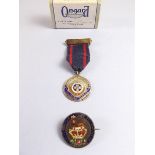 A silver Girls Life Brigade Service badge and a silver enamel coin badge