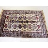 A Kashmir rug with ivory ground and geometric design - 227 x 153cm