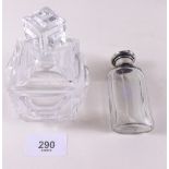 A cut glass scent bottle and another with white metal lid