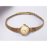 A 9 carat gold ladies Rotary wrist watch and 9 carat gold strap, total weight 14g