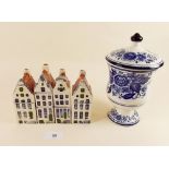 Four Delft houses and a Delft jar and cover